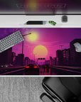40x20 inches desk pad with Sunset Drive Rush, capturing a neon-lit highway scene with glowing cars and a vibrant pink sunset over the city.