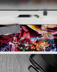 Anime mouse pad 36x16 inches featuring Demon Slayer squad: Tanjiro, Nezuko, Zenitsu, Inosuke vs. Daki in a dramatic scene.