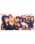 32x16 inches anime girl mouse pad with Love Live-style idol group in navy uniforms and drifting petals.