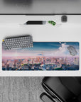 Intense 32x12 deskmat features glowing lights and twilight tones with intricate skyline details for fans of vibrant artistry