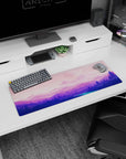Tranquil 32x12 mouse pad with cosmic landscapes in soft pinks and purples, perfect for a peaceful and functional workspace