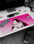 Close-up blushing anime girl glare in a neon pink triangle on a 40x20 inches desk pad, sweat-drop accent.