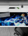 Striking 36x16 desk pad highlights Saber's glowing Noble Phantasm and determined stance in stunning detail