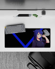 Black-and-blue anime girl mouse pad 28x12 inches, teal eyes, crisp contrast, cheeky gamer vibe.