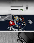 36x16 inches anime desk pad in steel gray and deep navy with punchy red accents, dark backdrop, high-energy vibe.
