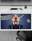 Slate background anime mouse pad 32x16 inches in clean white and navy armor, red faceplate, yellow V-fin.