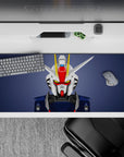 Slate background desk pad 36x16 inches with clean white/navy armor, red faceplate, yellow V-fin.