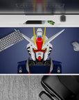 Slate backdrop with clean white and navy armor, red faceplate and yellow V-fin, 40x20 inches.