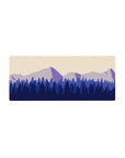 Mouse pad featuring serene mountain layers, 28x12 inches, in soft purples and blues for a relaxing workspace look.
