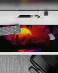 Striking 36x16 desk pad highlights neon city skyline with vibrant sunset hues and intricate palm tree silhouettes