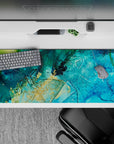 Peaceful 36x16 desk pad featuring turquoise and deep blue with golden accents, capturing the tranquil energy of the sea