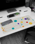 Artistic 36x16 inches desk pad featuring mid-century modern design, with colorful circles, stars, and geometric shapes for a vibrant, creative workspace.