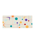 Mouse pad featuring mid-century modern design, 28x12 inches, with colorful circles, stars, and geometric shapes for a dynamic, stylish workspace.