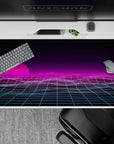 40x20 inches desk pad with a neon pink sunset, vaporwave gridlines, and retro-futuristic design, creating a dreamy atmosphere.