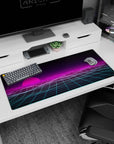 Artistic 36x16 inches desk pad with a neon pink sunset, futuristic gridlines, and a nostalgic vaporwave dreamscape.