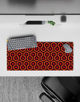 Compact 28x12 desk mat highlights warm tones and geometric flow for immersive retro-inspired focus and style