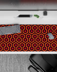 Striking 36x16 desk pad highlights warm orange and red hues with intricate hexagonal details in stunning artistry