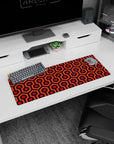 Small but impactful 32x12 desk mat showcases vintage vibes with striking orange and red geometric artistry