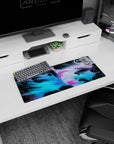 Colorful 28x12 inches mouse pad showcasing dynamic neon swirls, blending electric blue, pink, and black for a bold, creative desk setup.