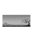 Mouse pad featuring Serenity Sakura Scene, 28x12 inches, with a grayscale cherry blossom tree and serene coastal landscape, evoking calm.