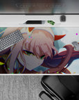 Vibrant 40x20 desk pad showcases Zero Two's captivating close-up with bursts of color for fan admiration