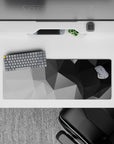 32x12 inches mouse pad with geometric grayscale design, blending varying shades of black, gray, and white with sharp angles for a refined look.