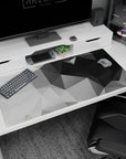 Large 40x20 inches desk pad featuring geometric grayscale design, with sharp angles and varying shades of black, gray, and white for minimalist elegance.