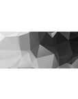 Desk pad featuring geometric grayscale design, 36x16 inches, with sharp angles and varying black, gray, and white shades for a sleek, modern aesthetic.