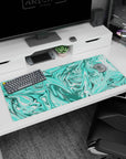 Artistic 36x16 inches mouse pad featuring vibrant turquoise aqua swirls, bringing dynamic motion and serenity to your workspace or gaming area.
