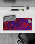 Energetic 28x12 mouse pad featuring vivid purple and red swirling pattern, perfect for adding a touch of vibrancy and creativity