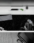 36x16 inches desk pad with Guts beneath a starlit sky, evoking calm and strength before the chaos of battle, ideal for adding a peaceful, introspective touch to your desk.