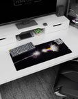 Cracked moon and shadow triangle scene mouse pad 28x12 inches, sliced by a bright rainbow beam.