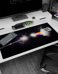 Cracked moon lit by a prism rainbow beam over a shadowy triangle desk pad 40x20 inches.