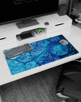 Serene 32x16 mouse pad with swirling oceanic blues and bubble-like details, perfect for adding a coastal vibe to your desk