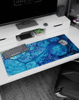 Refreshing 36x16 anime desk mat featuring oceanic blues and swirling patterns for a tranquil coastal workspace vibe