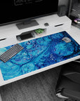 Serene 40x20 anime desk mat showcasing swirling oceanic blues and bubble-like details for a tranquil, coastal design