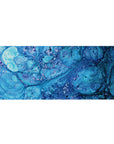 Oceanic blues 36x16 desk pad with swirling patterns and bubble-like details, adding a refreshing coastal touch to your desk