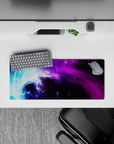 Compact 28x12 desk mat highlights vibrant nebula hues and cosmic swirls for immersive celestial vibes