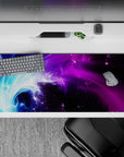 Striking 36x16 desk pad highlights vibrant purples, blues, and swirling nebula details in stunning artistry
