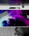 Dynamic 40x20 desk pad showcases swirling lights and galactic patterns for an immersive workspace vibe