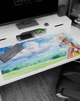 Desk pad featuring Darkness from Konosuba winking under a dreamy sky, 40x20 inches, with watercolor clouds and armor.
