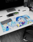 Aqua from Konosuba desk pad, 36x16 inches, features her iconic cheeky grin, icy tones, and pastel fans for a lively vibe.