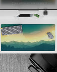Serene 32x16 mouse pad with a golden sky and deep blue mountains, perfect for a calm and precise work or gaming experience