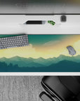 Peaceful 36x16 desk pad featuring a golden sky and deep blue mountains for a serene, scenic workspace look