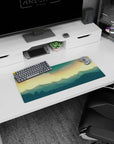 Golden sunset 28x12 mouse pad with deep blue mountains, perfect for creating a calm and inspiring desk setup