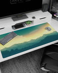Calm 40x20 anime desk mat with golden sunset hues and deep blue mountains for a tranquil, inspiring workspace vibe