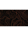 Desk pad featuring an orange topographic contour design, 40x20 inches, with bold orange lines on a black backdrop for a striking, modern look.