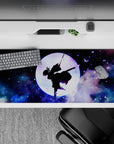 Shinobu silhouette on 36x16 inch anime desk pad, surrounded by violet butterflies and cosmic clouds from Demon Slayer.