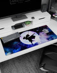 Shinobu silhouette on 36x16 inch desk pad with violet butterflies and cosmic clouds, inspired by Demon Slayer.