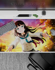 Warm peach-violet-gold sunset anime desk pad 40x20 inches with sparkly light flecks.